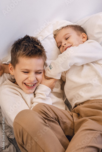 two brothers tickling and laughing