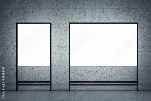 Business meeting  education and seminar concept with front view on two blank whiteboards with place for your logo or text on dark grey wall background. 3D rendering  mock up