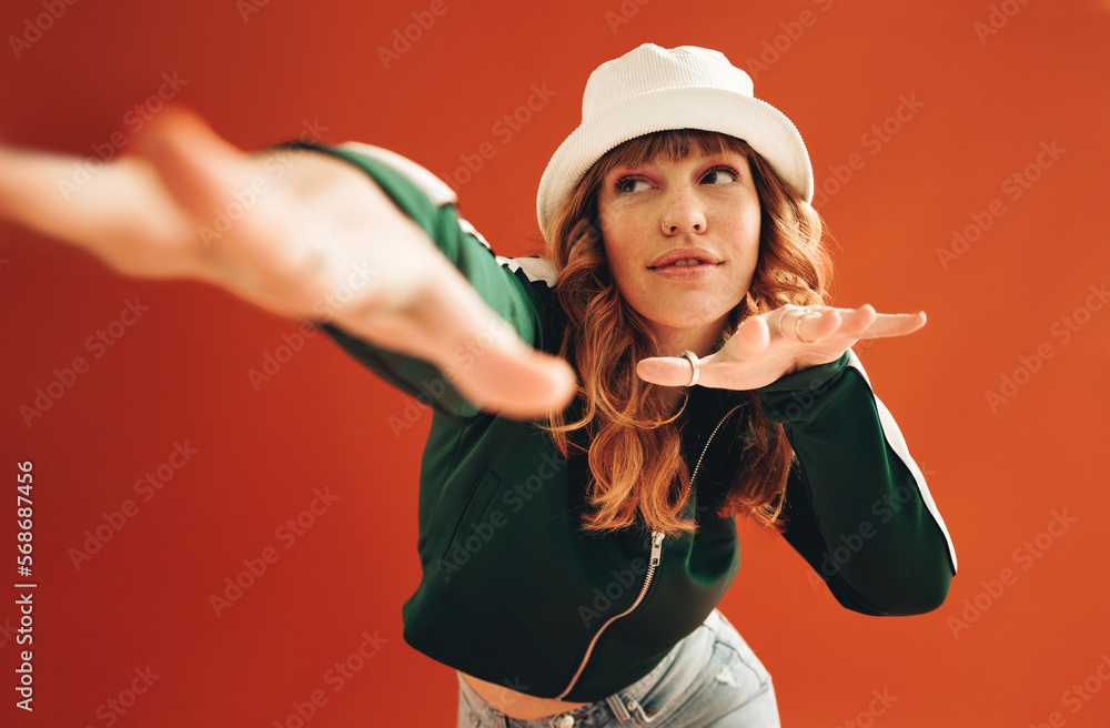 Female hipster dancing and having fun in a studio - obrazy, fototapety, plakaty 
