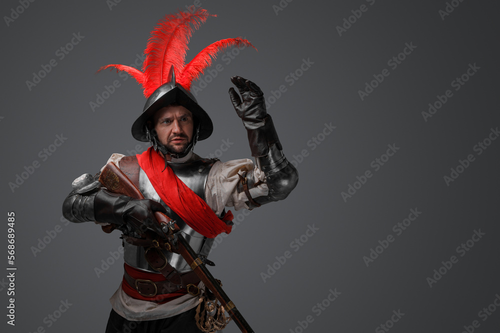 Portrait of conquistador gunslinger with flintlock rifle dressed in armor. Portrait of conquistador gunslinger with flintlock rifle dressed in armor.