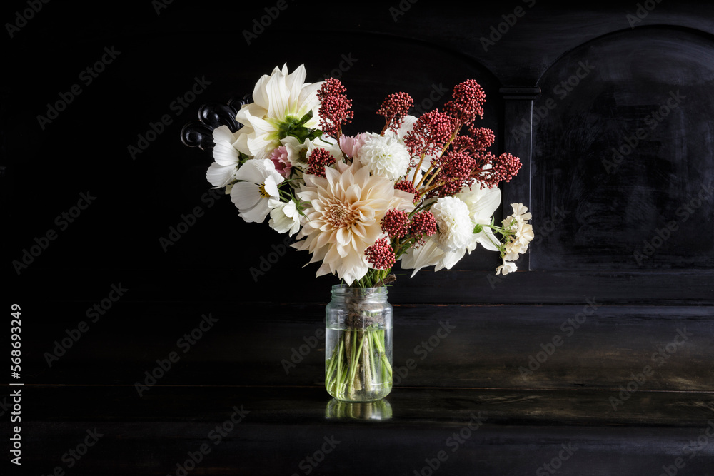 Arrangement of blooming seasonal flowers on piano Arrangement of blooming seasonal flowers on piano