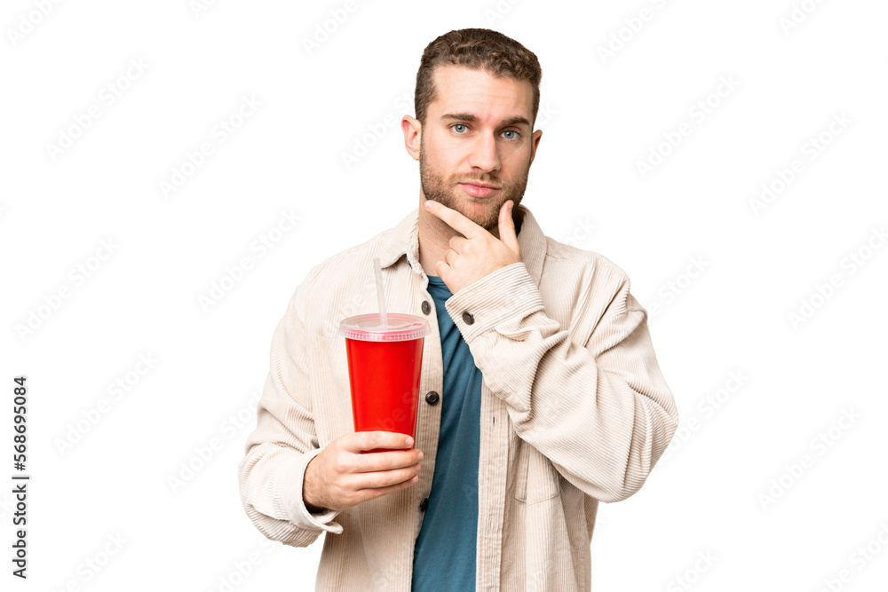 Young handsome blonde man holding soda over isolated chroma key background thinking Young handsome blonde man holding soda over isolated chroma key background thinking