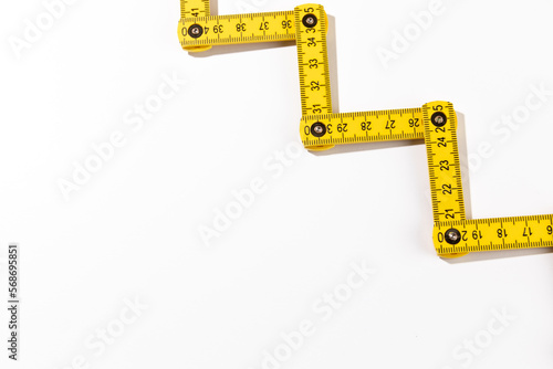 A carpenters ruler on white background