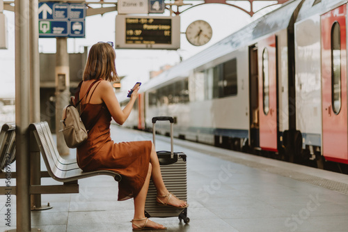 Tourist woman sitting in Antwerp train station photo