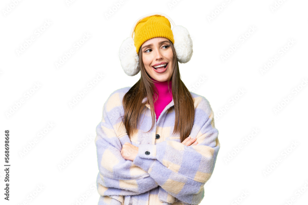 Young woman wearing winter muffs over isolated chroma key background happy and smiling Young woman wearing winter muffs over isolated chroma key background happy and smiling