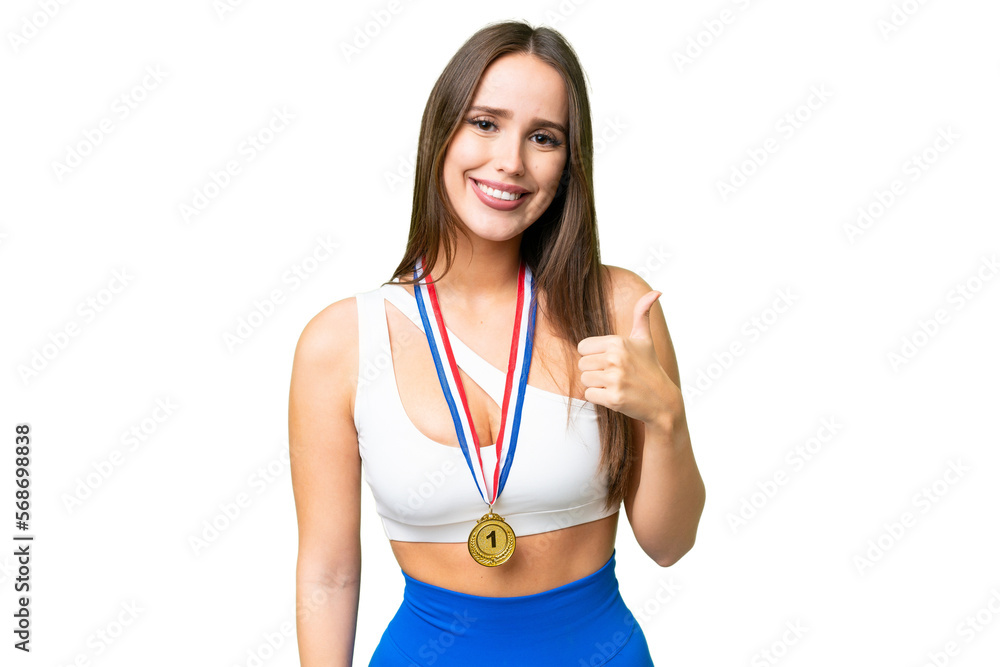 Young beautiful woman with medals over isolated chroma key background with thumbs up because something good has happened Young beautiful woman with medals over isolated chroma key background with thumbs up because something good has happened