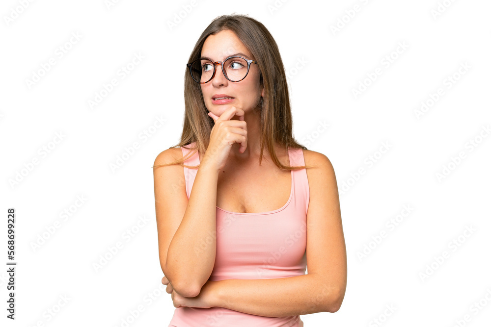 Young pretty woman over isolated background having doubts and thinking Young pretty woman over isolated background having doubts and thinking