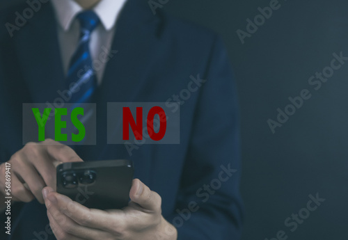 Businessman using smartphones show yes or no. 