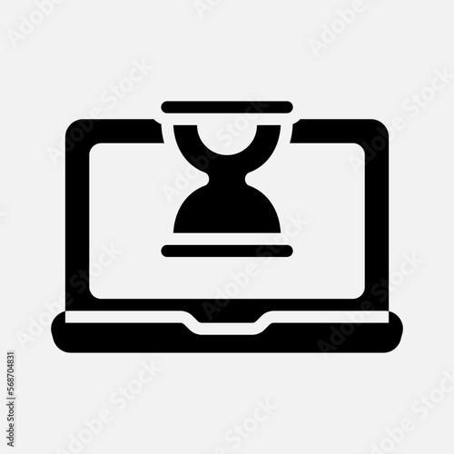 Hourglass laptop icon in solid style, use for website mobile app presentation © Anconerdesign