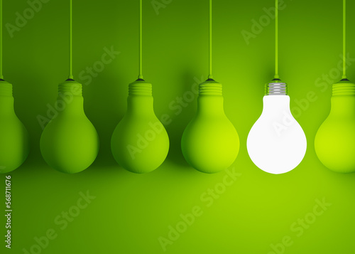 Hanging on cords light bulbs on a green background. Evolution from incandescent to LED lamps. Illustration in 3D.