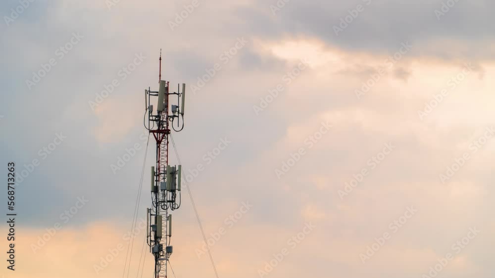 Time lapse of moving clouds over a 5G mobile tower. High-speed Internet and telecommunications. Connection and remote access to knowledge in online access. The future of communication between people. Time lapse of moving clouds over a 5G mobile tower. High-speed Internet and telecommunications. Connection and remote access to knowledge in online access. The future of communication between people.