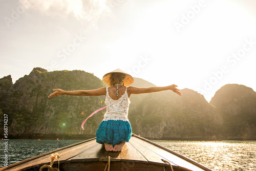 Beautiful woman on a long-tail boat in Thailand - Tourist visiting tropical island on south-east Asia, concepts about lifestyle and travel