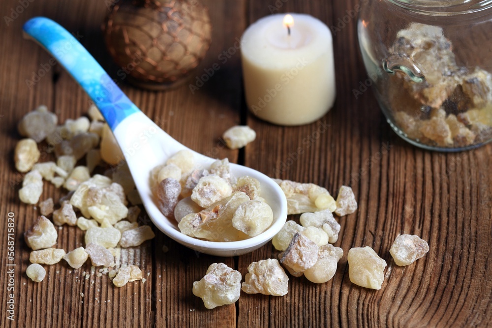 Aromatic resin from Boswellia sacra tree in a spoon. High quality frankincense resin from Oman is used for used for religious rites, perfumes and healing effects. Aromatic resin from Boswellia sacra tree in a spoon. High quality frankincense resin from Oman is used for used for religious rites, perfumes and healing effects.