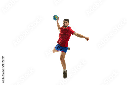 Strength. Dynamic studio shot of professional male handball player in motion training, playing isolated over white studio background. Concept of sport, action, motion, championship, sportive lifestyle