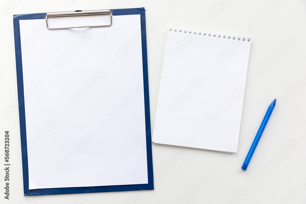 Top view Minimal design of open Notebook with pensil on white background with blank space. Flat lay Top view Minimal design of open Notebook with pensil on white background with blank space. Flat lay