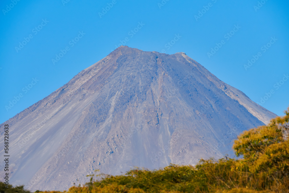 Nevado de Colima and Colima volcano together in a clear sky Nevado de Colima and Colima volcano together in a clear sky