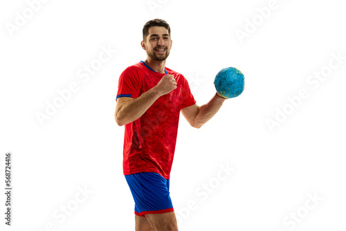 Winner. Portrait of young man, professional handball playing in uniform posing with ball isolated over white studio background. Concept of sport, action, motion, championship, sportive lifestyle