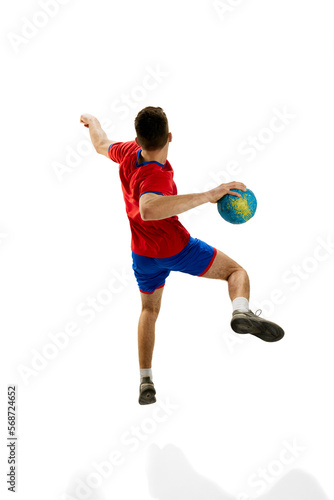 Back view. Dynamic studio shot of professional male handball player in motion training  playing isolated on white studio background. Concept of sport  action  motion  championship  sportive lifestyle