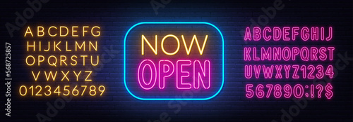 Now Open neon sign in frame on brick wall background.