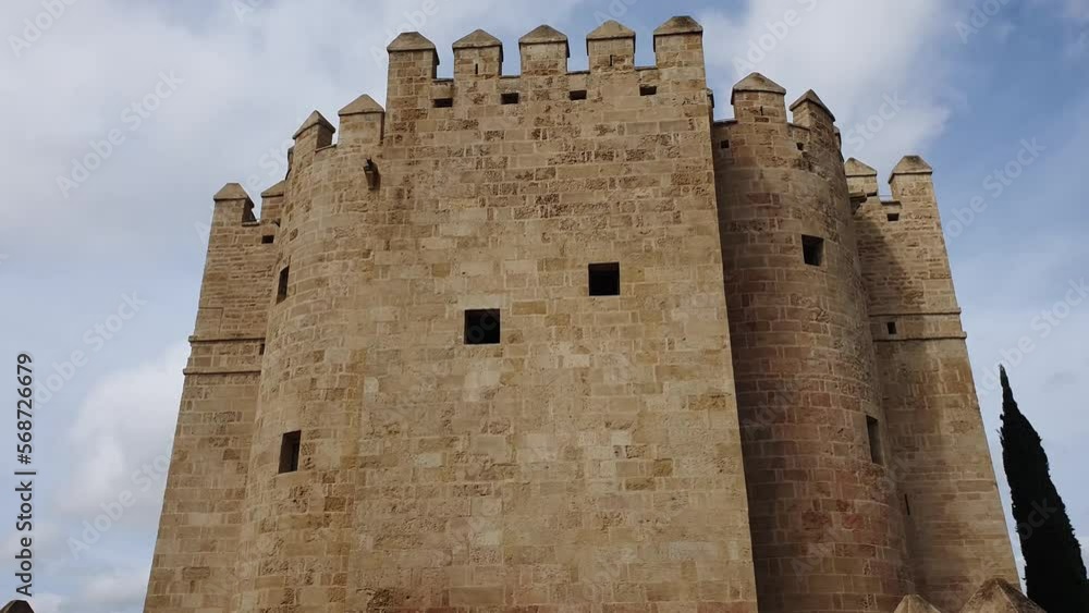 Impressive ancient fortress of Cordoba against a blue summer sky. Torre de calahorra Impressive ancient fortress of Cordoba against a blue summer sky. Torre de calahorra