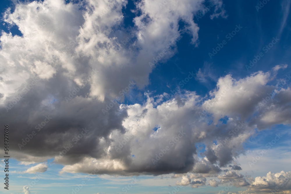 Fototapeta premium Blue sky with clouds background overlay. Ideal for sky replacement