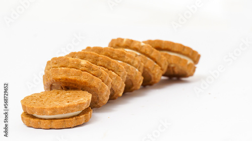biscuit sandwich cookies, baked biscuits stuffed with milk cream isolated on white background