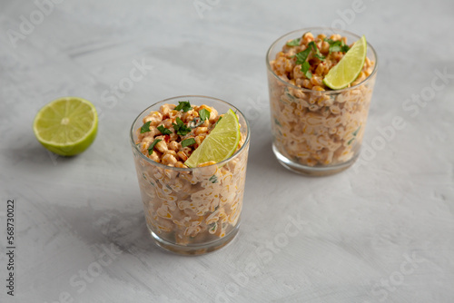 Homemade Mexican Corn Elote Esquites in Cups, side view.