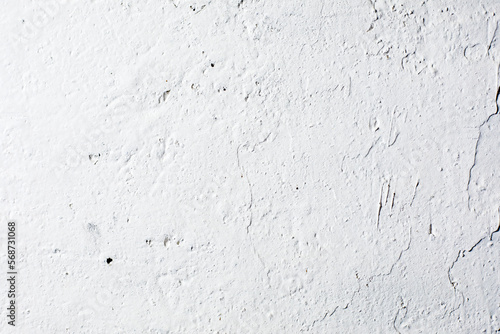 background of a white uneven concrete wall with white plaster, horizontal