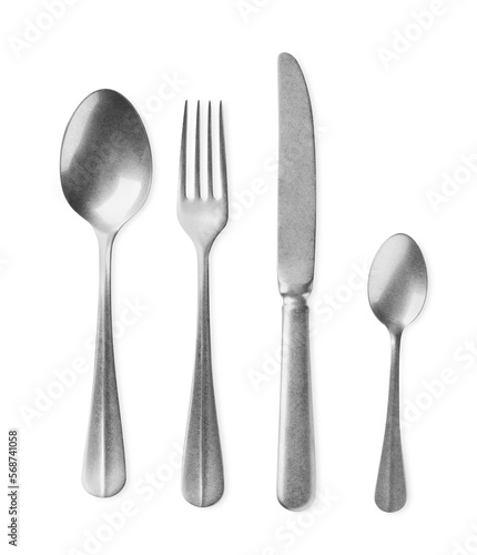 New shiny cutlery set on white background, top view