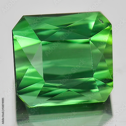 Natural gemstone green tourmaline on white background photo