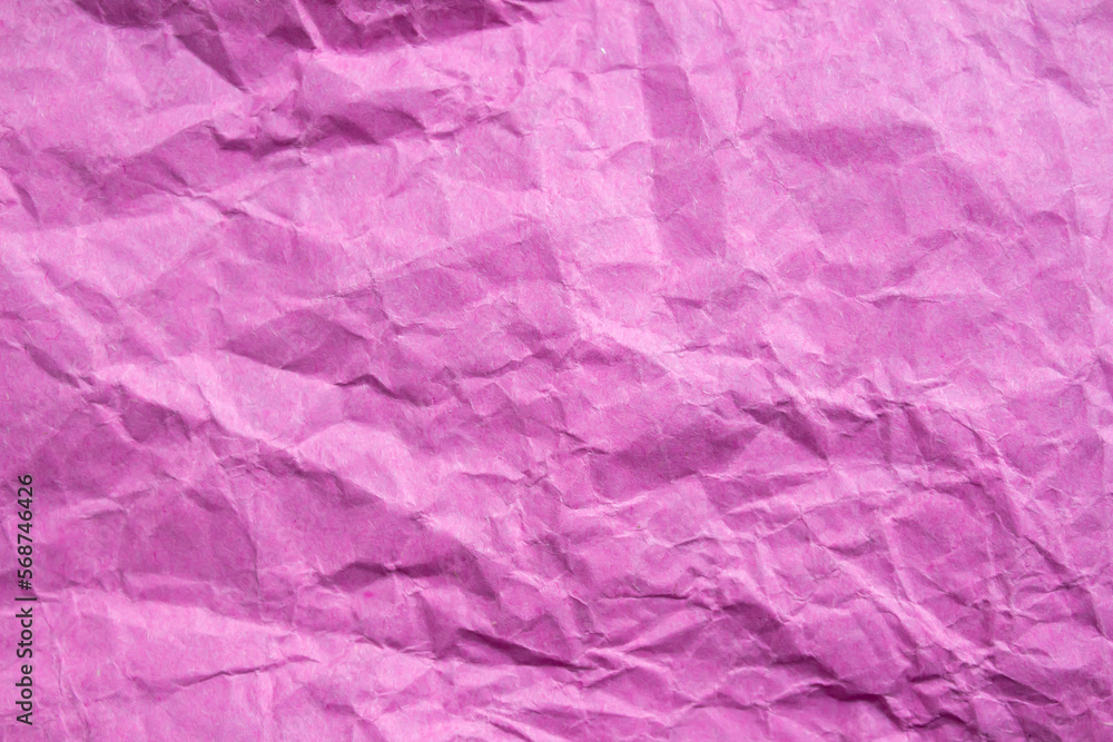 Crumpled pink paper texture background Crumpled pink paper texture background