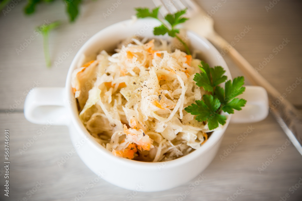 sauerkraut with carrots and spices in a bowl sauerkraut with carrots and spices in a bowl