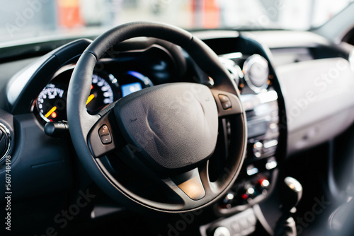 budget car interior steering wheel in the foreground © AvokadoStudio