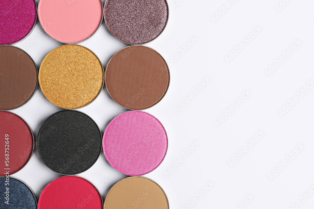 Beautiful eye shadow refill pans on white background, flat lay. Space for text Beautiful eye shadow refill pans on white background, flat lay. Space for text