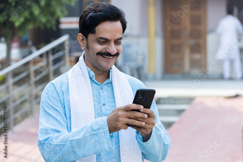 Indian farmer using smart phone