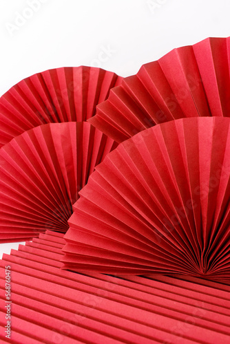 Red circle handmade paper fans on white background. Chinese New Year 2023 background