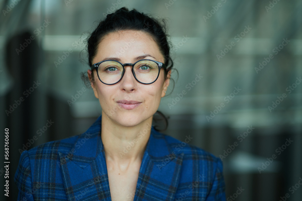 custom made wallpaper toronto digitalPortrait of a business woman with glasses smiling and happy. Dark blue jacket, confident woman looking in the camera High quality photo