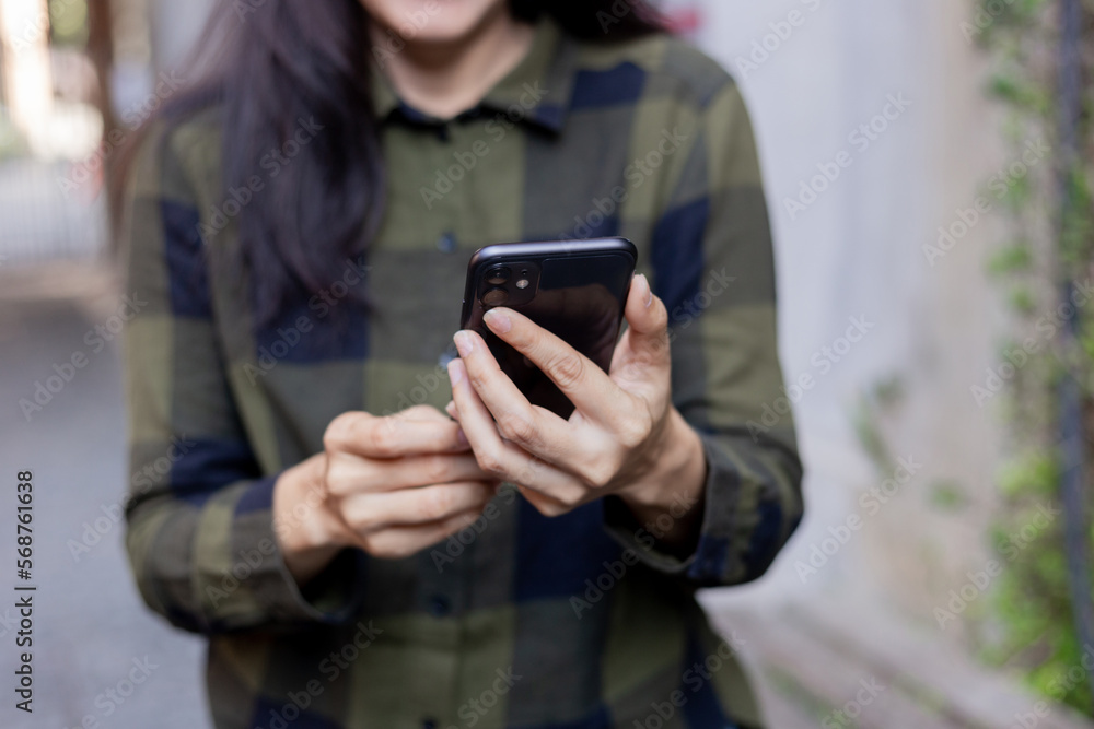 woman using cell phone hand holding mobile texting message contact us.chatting,search internet information.technology device communication connecting woman using cell phone hand holding mobile texting message contact us.chatting,search internet information.technology device communication connecting