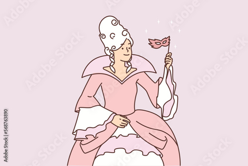 Woman in puffy dress for medieval ball with mask on stick and puffy superb hairstyle