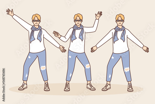 Creative guy in youth fashion clothes posing taking different poses and spreading arms to sides