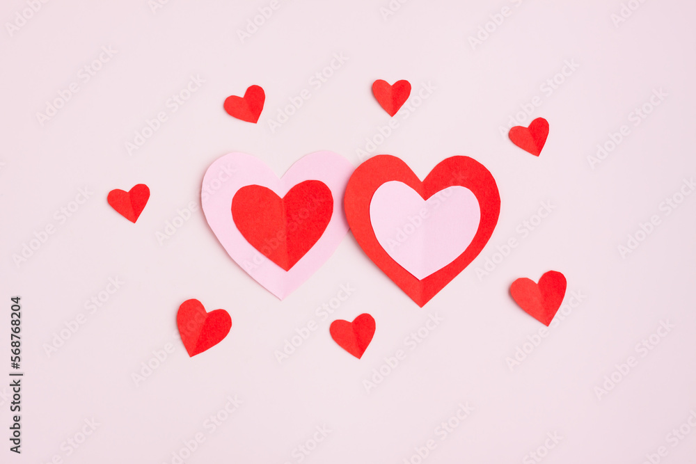 Red and Pink Paper Hearts on pink background, Heart shape papercut , Happy Valentine's day