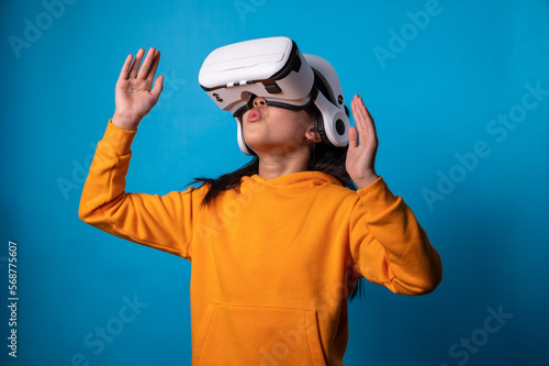 the studio isolated a portrait image of the girl wearing the VR goggle with the technology concept