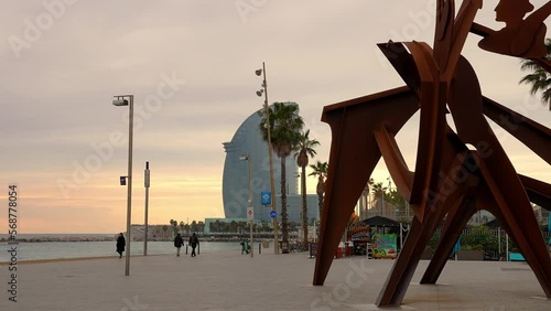 View of the Barceloneta beach with luxury hotel W Barcelona by the sea shore. Beautiful luxury hotel in Barcelona. photo