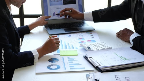 Accounting team manager working with cash flow chart and balance sheet, asset paperwork with stock market monthly statics