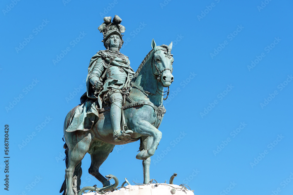 portuguese horse and rider statue against a blue sky