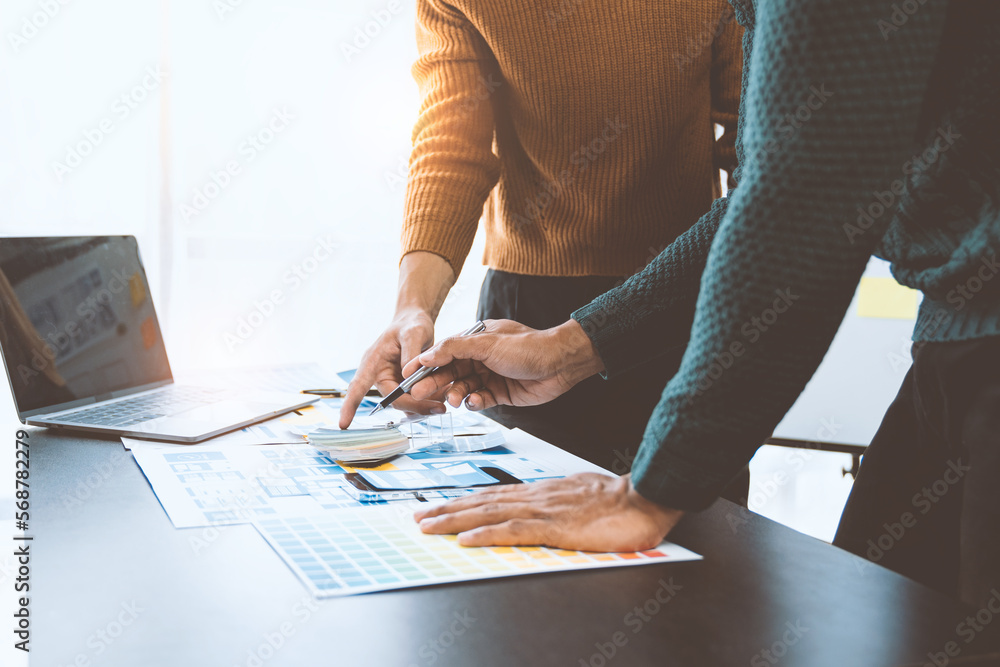 ux-developers-and-ui-designers-data-researchers-brainstorm-on-tabletop