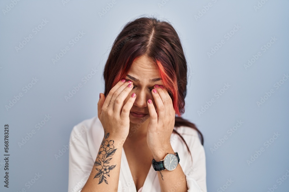 Young caucasian woman wearing casual white shirt over isolated background rubbing eyes for fatigue and headache, sleepy and tired expression. vision problem Young caucasian woman wearing casual white shirt over isolated background rubbing eyes for fatigue and headache, sleepy and tired expression. vision problem