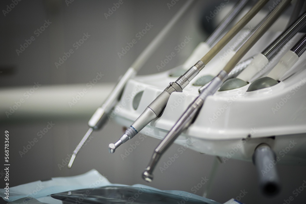 Naklejka premium The work of a dentist. Tools for dental prophylaxis. dental instruments and tools in the dentist's office.
