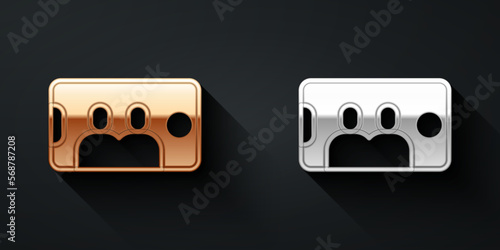 Gold and silver Selfie on mobile phone icon isolated on black background. Romantic self portrait, young friends taking selfie photo at smartphone. Long shadow style. Vector
