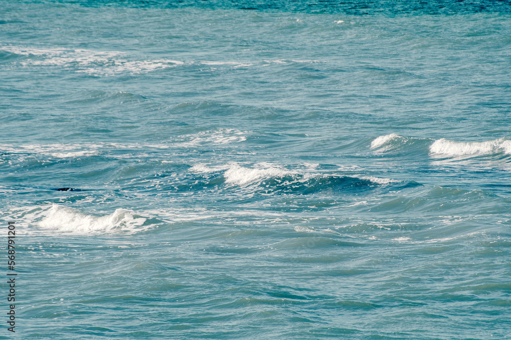 Obraz premium Splashing waves of the sea. Background with the summer sea and clear water.